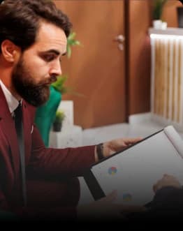 Relationship managers manually reviewing customer profiles